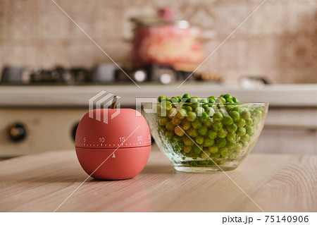 modern kitchen timer apple shaped on the background of the kitchen modern kitchen timer apple shaped on the background of the kitchen 75140906