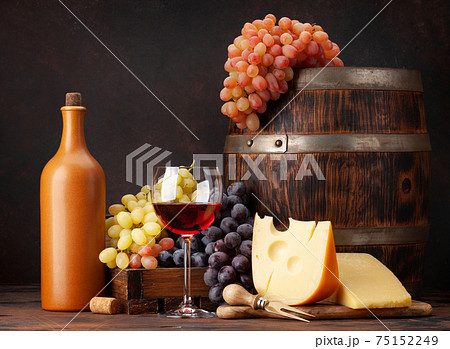 Wine bottle, grapes, cheese, glass of wine Wine bottle, grapes, cheese, glass of wine 75152249