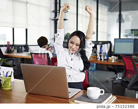 asian business woman celebrating completion of task asian business woman celebrating completion of task 75152386