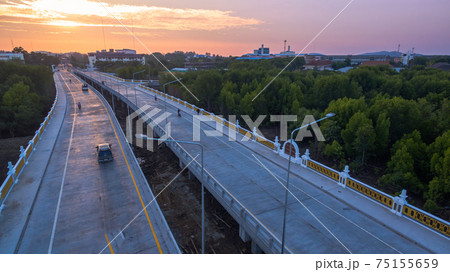The sun rises over Thepsrisin Bridge. Thepsrisin Bridge is a shortcut to connect the city from Saphan Hin intersection with Sakdidet intersection in order to reduce the bad traffic congestion. The sun rises over Thepsrisin Bridge. Thepsrisin Bridge is a shortcut to connect the city from Saphan Hin intersection with Sakdidet intersection in order to reduce the bad traffic congestion. 75155659