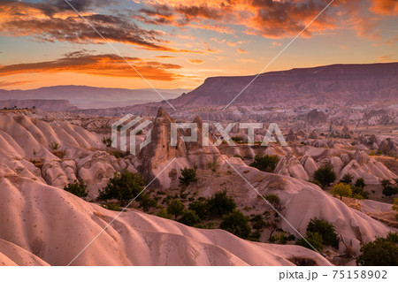 Rocky landscape in Cappadocia at sunset, Turkey. Rocky landscape in Cappadocia at sunset, Turkey. 75158902