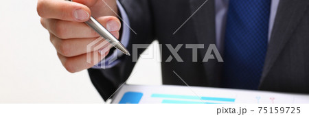 Male hand holding silver pen Male hand holding silver pen 75159725