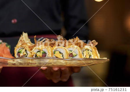 Close-up photo of appetizing set of sushi on plate Close-up photo of appetizing set of sushi on plate 75161231