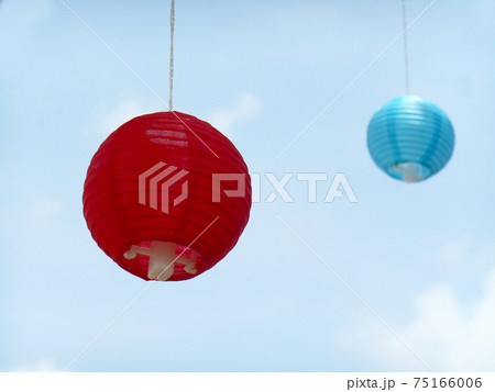 SEPANG, MALAYSIA -JANUARY 08, 2017: Colorful Japanese paper lanterns or tanglung hang outdoor at the park during daytime. SEPANG, MALAYSIA -JANUARY 08, 2017: Colorful Japanese paper lanterns or tanglung hang outdoor at the park during daytime. 75166006