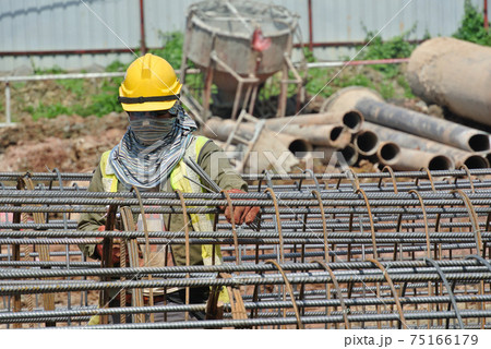 SELANGOR, MALAYSIA -MAY 16, 2017: Welder wearing protective mask during welding metal at the construction site. SELANGOR, MALAYSIA -MAY 16, 2017: Welder wearing protective mask during welding metal at the construction site. 75166179