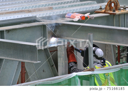 SELANGOR, MALAYSIA -MAY 16, 2017: Welder wearing protective mask during welding metal at the construction site. SELANGOR, MALAYSIA -MAY 16, 2017: Welder wearing protective mask during welding metal at the construction site. 75166185