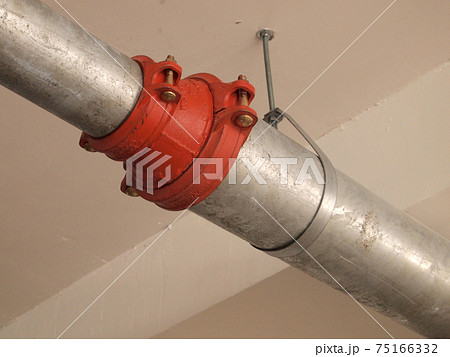 KAJANG, MALAYSIA -JUNE 16, 2017: Sprinkler system pipe in hang at the slab soffit. Sprinkler is an active fire fighting system in the building.  75166332