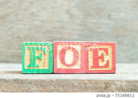 Color alphabet letter block in word foe on wood background 75166611
