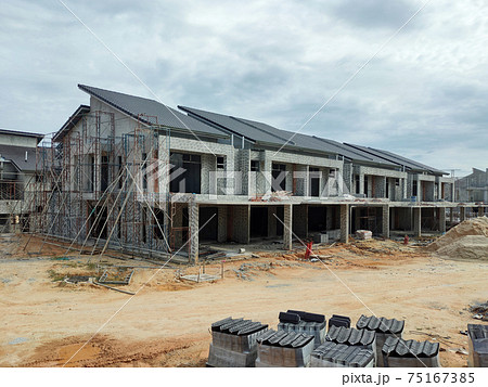 SEREMBAN, MALAYSIA -APRIL 15, 2020: New double story luxury terrace house under construction in Malaysia.  Designed by an architect with a modern and contemporary style. 75167385