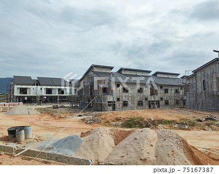 SEREMBAN, MALAYSIA -APRIL 15, 2020: New double story luxury terrace house under construction in Malaysia.  Designed by an architect with a modern and contemporary style. 75167387