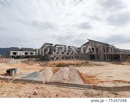 SEREMBAN, MALAYSIA -APRIL 15, 2020: New double story luxury terrace house under construction in Malaysia.  Designed by an architect with a modern and contemporary style. 75167388