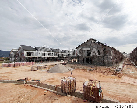 SEREMBAN, MALAYSIA -APRIL 15, 2020: New double story luxury terrace house under construction in Malaysia.  Designed by an architect with a modern and contemporary style. 75167389