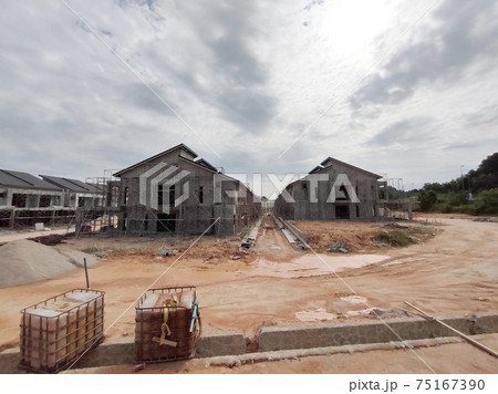 SEREMBAN, MALAYSIA -APRIL 15, 2020: New double story luxury terrace house under construction in Malaysia.  Designed by an architect with a modern and contemporary style. 75167390