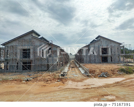 SEREMBAN, MALAYSIA -APRIL 15, 2020: New double story luxury terrace house under construction in Malaysia.  Designed by an architect with a modern and contemporary style. 75167391