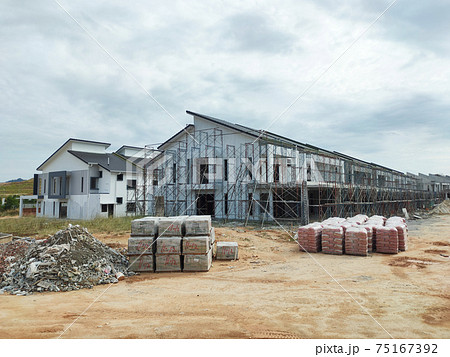 SEREMBAN, MALAYSIA -APRIL 15, 2020: New double story luxury terrace house under construction in Malaysia.  Designed by an architect with a modern and contemporary style. 75167392