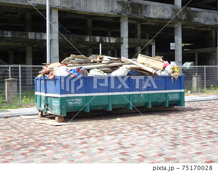 SELANGOR, MALAYSIA -JANUARY 15, 2017: Construction wasted disposal bin used to collect rubbish and unused material at the construction site. SELANGOR, MALAYSIA -JANUARY 15, 2017: Construction wasted disposal bin used to collect rubbish and unused material at the construction site. 75170028