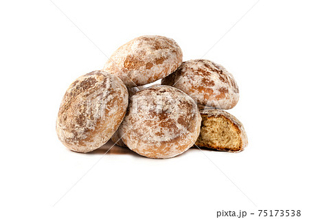 Gingerbread cookies on a white background. Homemade gingerbread cookies close-up. Gingerbread cookies on a white background. Homemade gingerbread cookies close-up. 75173538