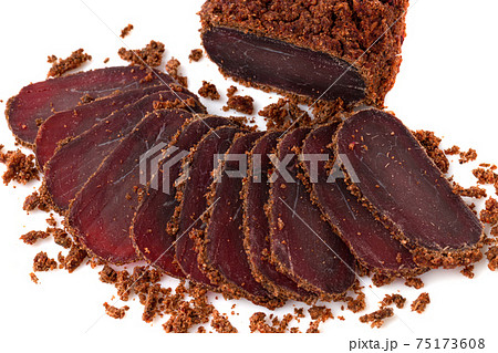 Jerky on a white background. Close-up of basturma sliced into pieces. 75173608