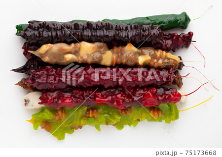 Churchkhela on a white background. Georgian sweet closeup on a white background. Churchkhela on a white background. Georgian sweet closeup on a white background. 75173668