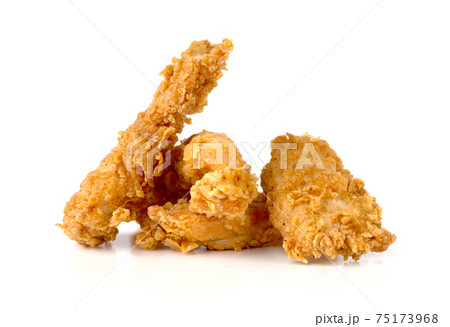 Fried chicken fillets on a white background. Fried chicken nuggets close-up. Fried chicken fillets on a white background. Fried chicken nuggets close-up. 75173968