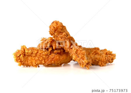 Fried chicken fillets on a white background. Fried chicken nuggets close-up. Fried chicken fillets on a white background. Fried chicken nuggets close-up. 75173973