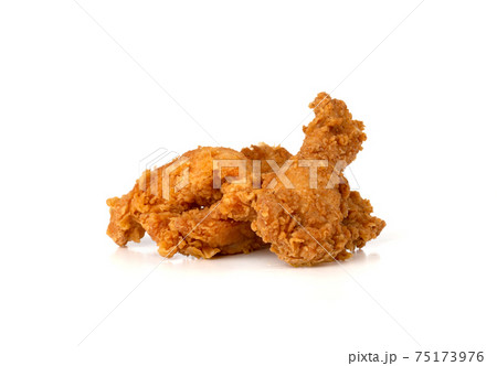 Fried chicken fillets on a white background. Fried chicken nuggets close-up. Fried chicken fillets on a white background. Fried chicken nuggets close-up. 75173976