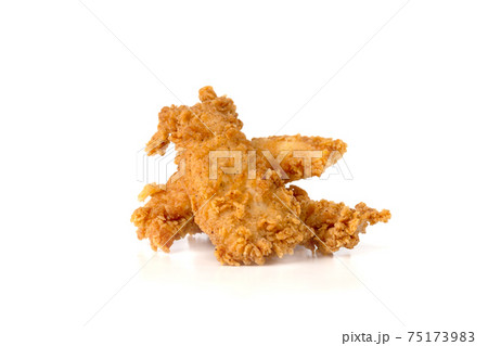 Fried chicken fillets on a white background. Fried chicken nuggets close-up. Fried chicken fillets on a white background. Fried chicken nuggets close-up. 75173983