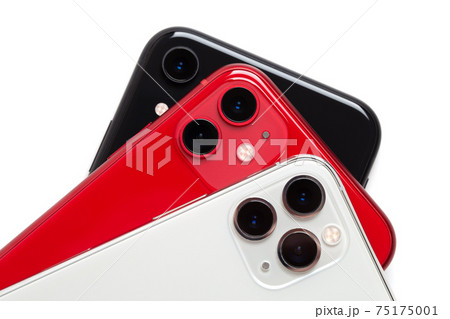 Three smartphones close-up on a white background. Three smartphones close-up on a white background. 75175001