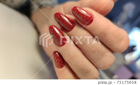 Closeup photo of a beautiful female hands with elegant manicure Closeup photo of a beautiful female hands with elegant manicure 75175658