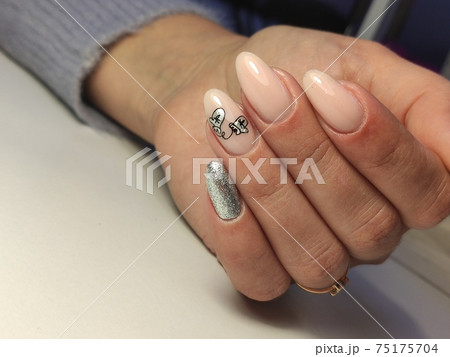 Closeup photo of a beautiful female hands with elegant manicure Closeup photo of a beautiful female hands with elegant manicure 75175704