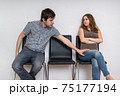 Young man is touching woman in waiting room. Sexual harassment c 75177194