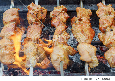 close-up of the fried meat with fire and coal close-up of the fried meat with fire and coal 75180681