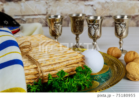 Passover holiday traditional celebration with four cup wine kosher matzah on Jewish Pesach 75180955