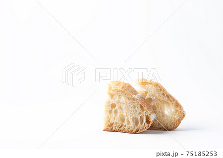 Two pieces of white wheat bread with intoxicated sourdough. White background Two pieces of white wheat bread with intoxicated sourdough. White background 75185253