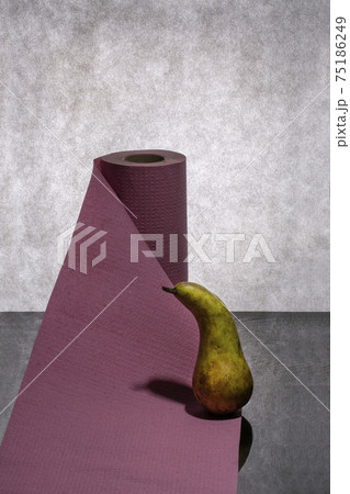 Still life with ripe pear and paper towel Still life with ripe pear and paper towel 75186249