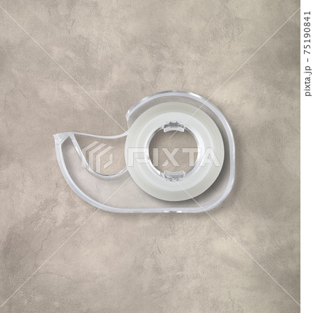 Scotch tape dispenser isolated on concrete background 75190841