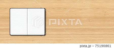 Black open lined notebook isolated on wooden background. Horizontal banner Black open lined notebook isolated on wooden background. Horizontal banner 75190861