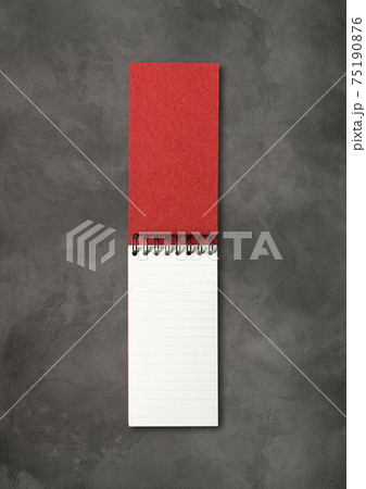 Blank open spiral notebook isolated on dark concrete background 75190876