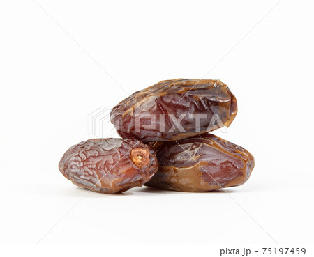 bunch of dried dates isolated on white background bunch of dried dates isolated on white background 75197459