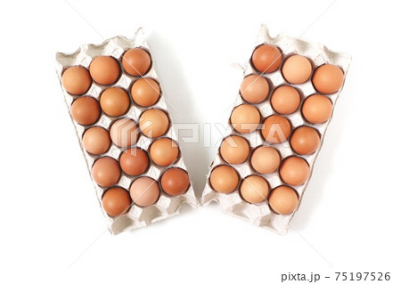 Eggs of chicken in paper tray on white background. Top view. Eggs of chicken in paper tray on white background. Top view. 75197526