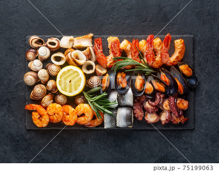 Seafood charcuterie board with shrimp, oysters, fish and octopus Seafood charcuterie board with shrimp, oysters, fish and octopus 75199063