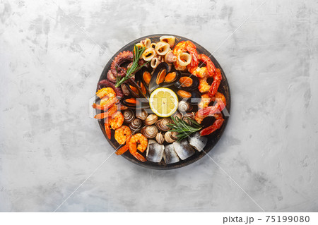 Seafood charcuterie board with shrimp, oysters, fish and octopus 75199080