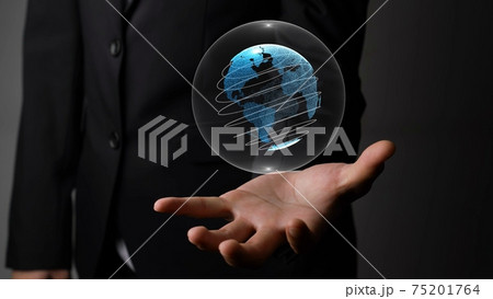 Human hand holding earth globe holographic technology 75201764