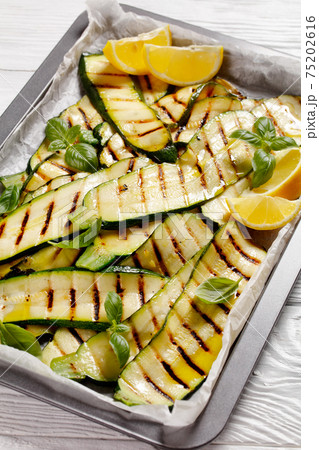 grilled zucchini slices on a sheet pan grilled zucchini slices on a sheet pan 75202616