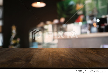 Empty dark wooden table in front of abstract blurred bokeh background of restaurant . can be used for display or montage your products.Mock up for space. Empty dark wooden table in front of abstract blurred bokeh background of restaurant . can be used for display or montage your products.Mock up for space. 75202959