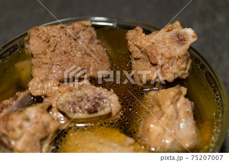 rib pork boil until tender and clear soup in a bowl rib pork boil until tender and clear soup in a bowl 75207007
