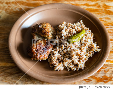 russian Kotleta with buckwheat porridge on plate 75207055