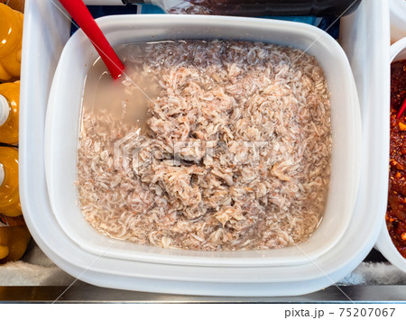 salted krill in plastic basin on market 75207067