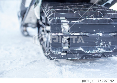 Rear suspension of a snowmobile in winter. Riding in the snow Rear suspension of a snowmobile in winter. Riding in the snow 75207192