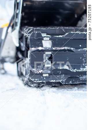 Rear suspension of a snowmobile in winter. Riding in the snow Rear suspension of a snowmobile in winter. Riding in the snow 75207193